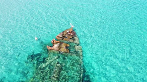 old-rusty-shipwreck-in-Turquoise-sea-dron-circle