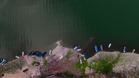 Aerial-Top-Down-Perspective-of-Coastal-Scene-with-Boats-in-Mexico,-Pull-Out-Shot