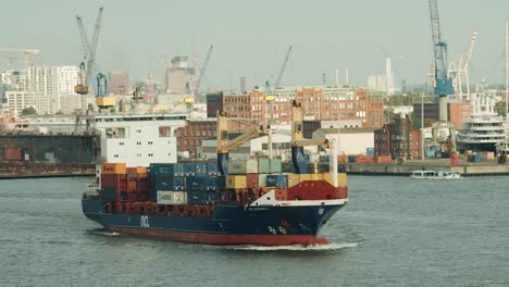 Small-containership-departing-hamburg-with-containers-loaded-onto-its-decks
