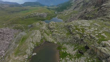 Rocky-landscape-and-mountain-lake-in-summer-season-at-Campagneda-of-Valmalenco-in-Italy