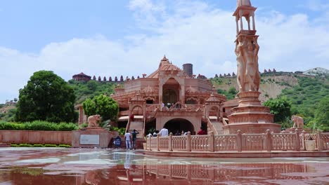 artistic-red-stone-jain-temple-at-morning-from-unique-angle-video-is-taken-at-Shri-Digamber-Jain-Gyanoday-Tirth-Kshetra,-Nareli-Jain-Mandir,-Ajmer,-Rajasthan,-India-an-Aug-19-2023.