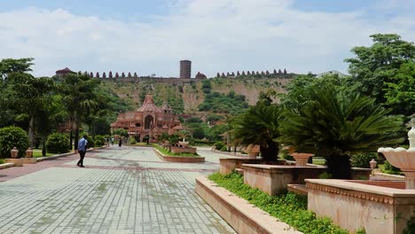 artistic-red-stone-jain-temple-at-morning-from-unique-angle-video-is-taken-at-Shri-Digamber-Jain-Gyanoday-Tirth-Kshetra,-Nareli-Jain-Mandir,-Ajmer,-Rajasthan,-India-an-Aug-19-2023.