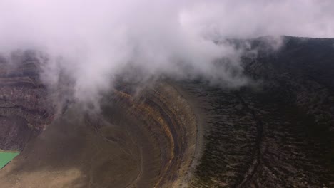 Aerial-flyover:-Inner-rim-of-Santa-Ana-Volcano-summit-crater-in-cloud