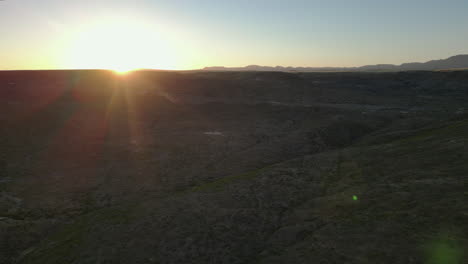 Desert-Sunrise:-Sun-Peaks-over-the-Mountains-of-Desert-Landscape-[4K