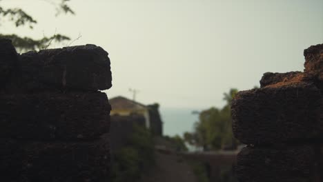 View-to-the-Ocean-Between-the-Bricks-of-an-Ancient-Fortress