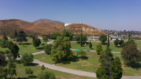 Wide-aerial-shot-flying-over-manicured-grounds-at-a-California-mortuary