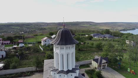 aerial-of-Saint-Nicholas-Church-steeple,-Biserica-Sfantul-Nicolae,-Orthodox-church-in-Aroneanu,-Romania