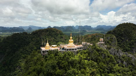 Most-Amazing-Temple-on-Mountain-Top,-Golden-Buddha-Statue,-Krabi-Sightseeing-Buddhist-Temple,-Wat-Tham-Sue-Tiger-Cave-Temple