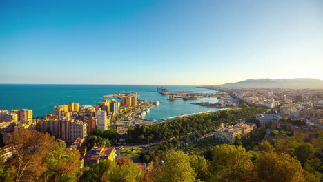 Looking-over-the-Port-of-Malaga,-Spain-into-the-port-and-Alboran-Sea---daytime-time-lapse