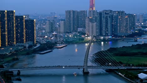 In-this-editorial-illustrative-view-from-the-Saigon-Skydeck-atop-the-Bitexco-Financial-Tower,-Ho-Chi-Minh-City-is-bejewelled-with-an-imposing-skyline,-beautiful-scenery-and-city-lights