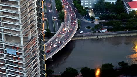 In-this-editorial-illustrative-view-from-the-Saigon-Skydeck-atop-the-Bitexco-Financial-Tower,-Ho-Chi-Minh-City-is-bejewelled-with-an-imposing-skyline,-beautiful-scenery-and-city-lights