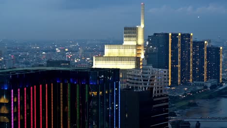 In-this-editorial-illustrative-view-from-the-Saigon-Skydeck-atop-the-Bitexco-Financial-Tower,-Ho-Chi-Minh-City-is-bejewelled-with-an-imposing-skyline,-beautiful-scenery-and-city-lights