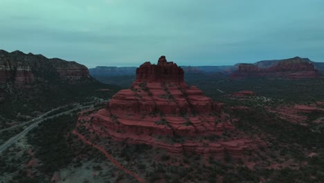 Red-Stone-Landscape,-Bell-Rock-In-Sedona,-Arizona-At-Sunset---aerial-shot