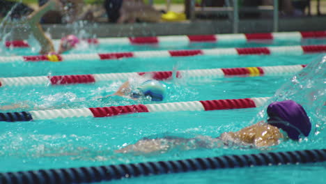 Close-up-shot-of-professional-swimmers-participating-in-a-swimming-competition