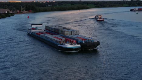 Freight-vessel,-the-Sento-passes-another-container-ship-on-the-Oude-Maas-river