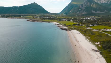 Flyover-aerial-footage-of-Reipa-Beach-,Norway,-drone-shot-following-the-highway