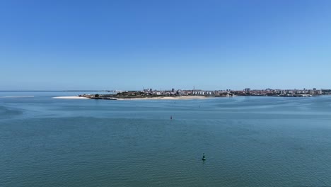 Drone-shot-flying-over-the-water-from-Seixal-to-Barreiro