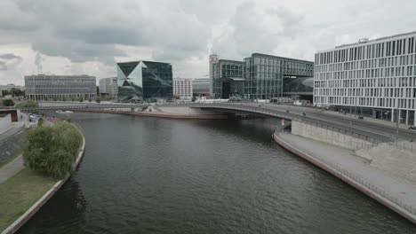 Berlin-landmarks-across-Spree-river,-cloudy-day-in-Brandenburg,-Germany