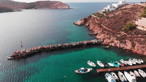 Drone-aerial-shot-of-a-small-greek-marina-cove-on-a-greek-island