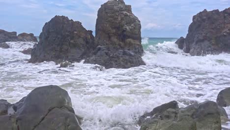 Slow-Motion-Waves-and-Towering-Rocks-on-the-Coast-of-Surigao-Del-Norte,-Philippines