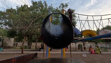 A-small-child-is-sledding-in-a-public-theme-park-on-holiday