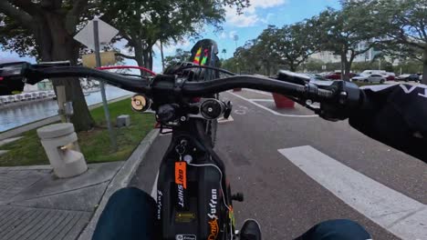 FPV-of-bike-stunts,-man-performing-stunts-on-ebike-on-the-road