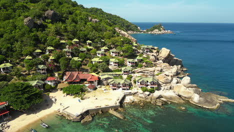 Hillside-luxury-resort-of-Koh-Tao-island,-Scuba-diving-paradise-at-thai-beach-surrounded-by-corals,-Thailand,-Aerial-View