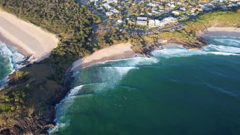 Top-Down-View-Over-Cabarita-Beach-And-Norries-Head-At-Sunset-In-Australia---drone-shot
