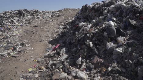 Slow-motion-view-of-loads-of-plastic-in-a-waste-dumping-ground