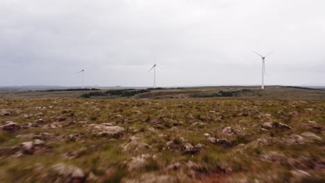 Low-elevation,-cinematic-drone-shot-of-a-wind-farm-on-the-Outer-Hebrides