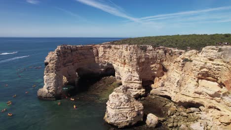 Flying-over-Praia-Da-Marinha--in-Algarve,-Portugal