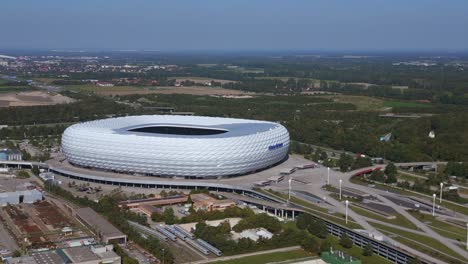 Beautiful-aerial-top-view-flight-Bavarian-Munich-Arena-stadium-national-football-soccer-team-Germany,-summer-sunny-blue-sky-day-23