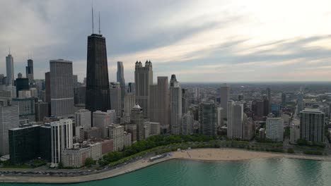 Chicago-USA-Cityscape-Skyline,-Central-Towers-and-Traffic-by-Lake-Michigan,-Drone-Shot