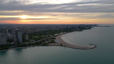 Chicago-USA-and-Michigan-Lake,-High-Rise-Panoramic-Drone-Shot-of-Cityscape-at-Sunset