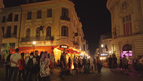 Old-town-streets-with-tourists-at-night,-Bucharest,-Romania