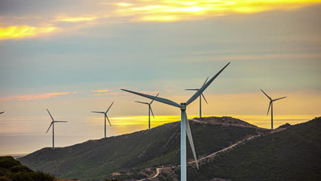 Wind-farm-near-Gibraltar,-Spain-produces-efficient,-affordable-power---sunset-time-lapse