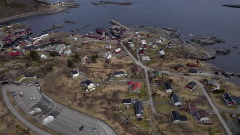 Aerial-dolly-forwarding-establishing-shot-over-the-village-A-in-Lofoten-in-late-winter-as-spring-begins-to-thaw-the-snow-and-the-sun-comes-out-after-a-long-polar-night