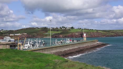 Establishing-shot-of-Dunmore-East-Harbour-and-fishing-village-in-Waterford-Ireland-September-morning