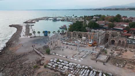Establishing-aerial-view-Apollon-temple-construction-work-in-the-Side-coastal-town,-Antalya-province-of-Turkey