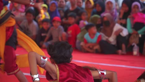 Slow-motion-shot-of-male-children-showing-INDONESIAN-TRADITIONAL-DANCE,-TOPENG-IRENG