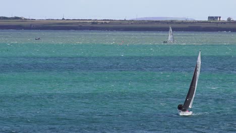 Yachting-at-Waterford-Estuary-wit-the-Wexford-coast-in-the-background-on-a-sunny-Autumn-day