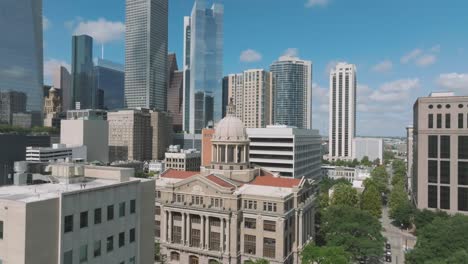 An-aerial-establishing-shot-gradually-zooms-in-on-the-Harris-County-Court-House