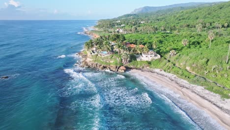 Beautiful-sand-beach-and-expensive-home-with-pool-in-Barahona,-aerial-forward