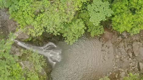 Beautiful-Aerial-Shot-Looking-Down-at-Lumondo-Waterfall-in-Alegria,-Surigao-Del-Norte,-Philippines