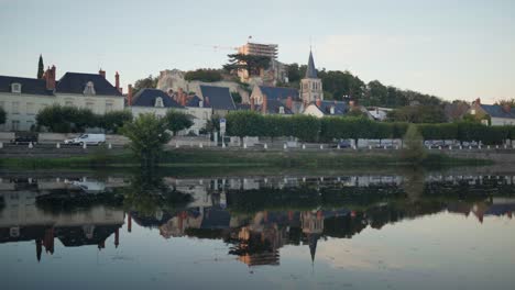 Residents-of-Montrichard-Val-de-Cher-on-the-move-reflected-in-the-idyllic-water-of-the-Cher-River