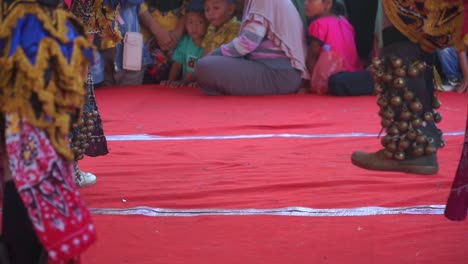 Close-up-of-dancers-wearing-traditional-leg-bells-for-a-traditional-indonesian-dance