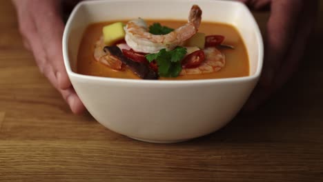 Close-up-video-of-chef-serving-ready-dish-with-shrimp