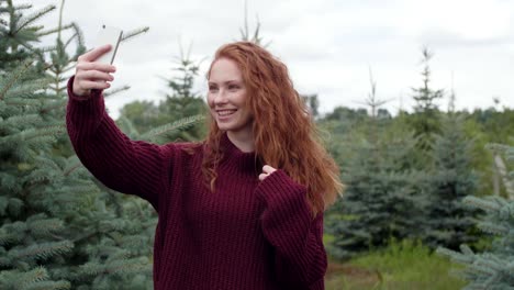 Woman-making-a-selfie-in-forest
