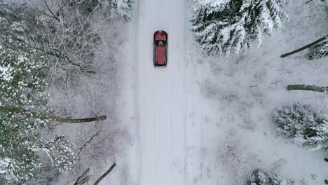 Aerial-view-of-car-on-road-in-beautiful-winter-scenery