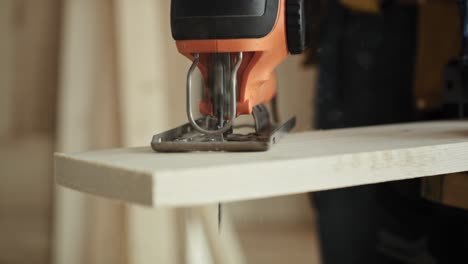 Handheld-video-of-sawing-wood-with-an-electric-jigsaw